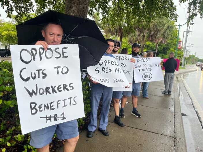 Federal workers protest at Sen. Scott's office
