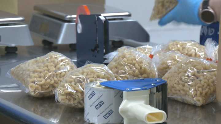 Volunteers gather to help pack food for Great Plains Food Bank's annual Packathon