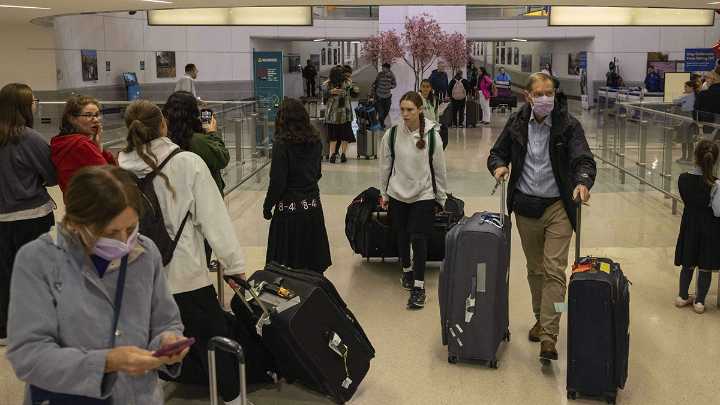 Trump’s new travel ban takes effect as tensions escalate over immigration enforcement