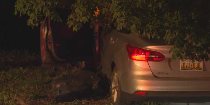 Three people injured after crashing into tree in Lansing