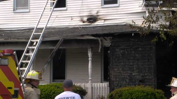 10 displaced after house fire in Warwick