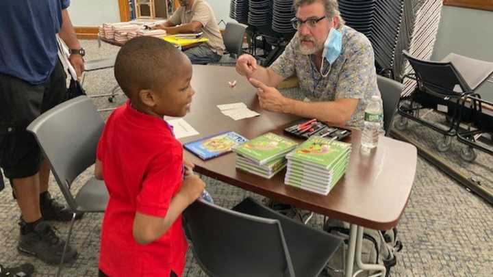 'Light a Candle for Literacy' parade and festival celebrates books in Syracuse