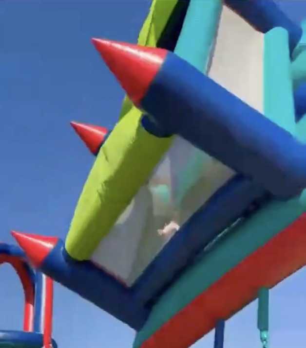 Terrifying moment bouncy castle takes off in freak wind flying 40ft into air sending children plunging back to earth