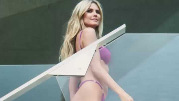 Heidi Klum frolics in leopard-print and purple bikinis on a yacht for new Calzedonia advert