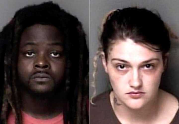 Parents charged after their son fatally hit by car
