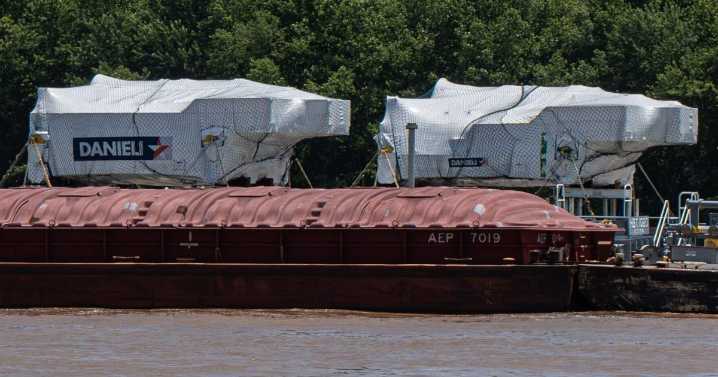 Machinery travels the Ohio River heading to Nucor steel mill in Mason County