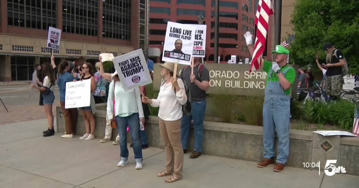 Group of people protest ICE in Colorado Springs Monday