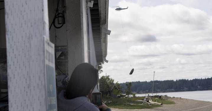 Flying boats make for a rare sight as Washington clears derelict vessels by helicopter