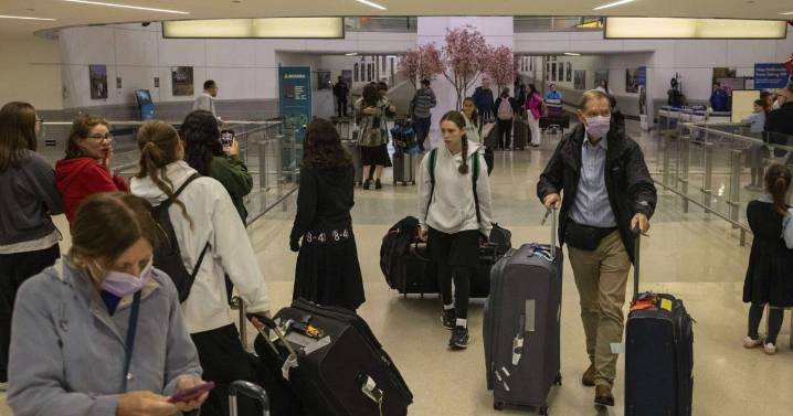 Some visitors report extra scrutiny at US airports as Trump's new travel ban begins
