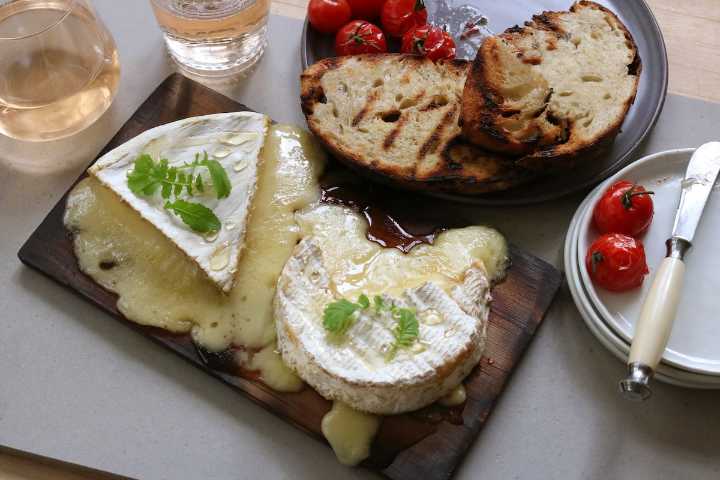 Love cheese? Serve up the gooey goodness on a wooden plank for a flavourful twist