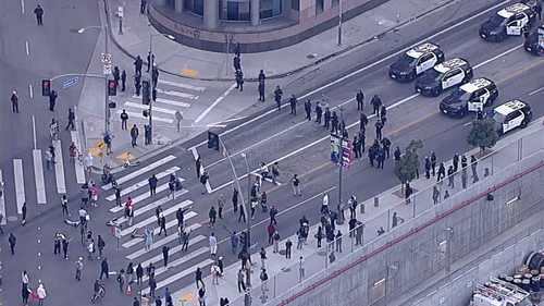 Protesters march in downtown Los Angeles after ICE immigration raids across city