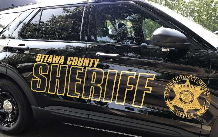 Woman hospitalized after crashing into stopped cars, fence