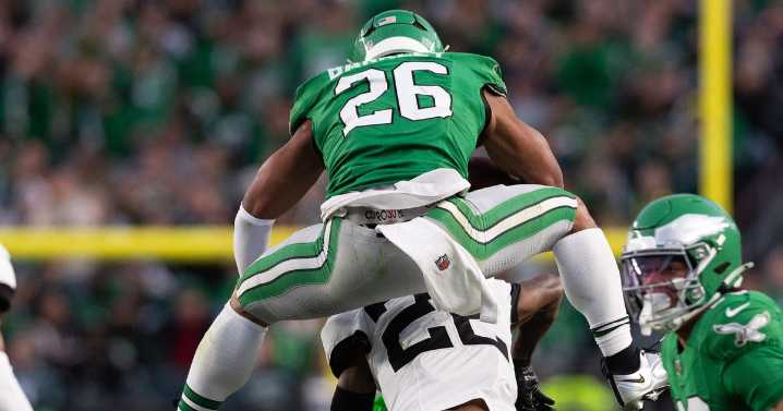 Saquon Barkley backwards hurdles on to 'Madden NFL 26' cover