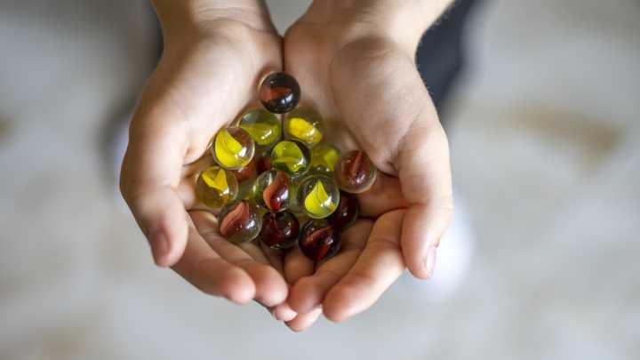 Reuse Old Marbles To Turn A Plain Planter Into A Dimensional Design