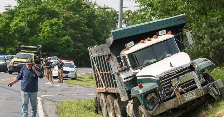 One killed, one injured in crash involving dump truck and SUV