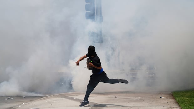 U.S. immigration authorities clash with protesters during L.A.