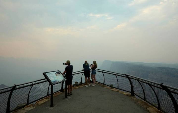Fire crews along Grand Canyon are trying to save cabins after loss of historic lodge