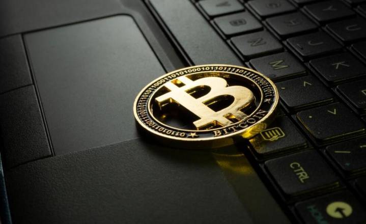 Bitcoin pulls back to three-week low after record