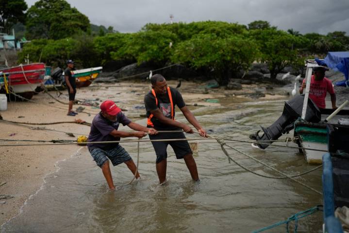 The Latest: Tsunami warnings lifted in most places