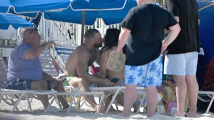 Conor McGregor kisses mystery lady as he laps up attention from women on a beach in Florida without fiancee Dee Devlin