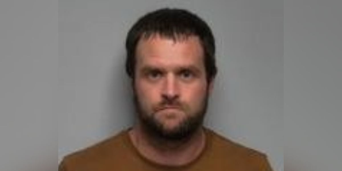 Man wanted after stolen vehicle found in justice center parking lot