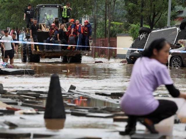 Extreme weather kills 30 in Beijing as year's rain falls in a week