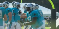 Former Okemos standout offensive lineman Taylor Moton signs a two-year, $44 million extension with Carolina