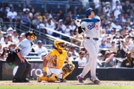 Shohei Ohtani high-fives a heckler after his homer to cap Dodgers' comeback rivalry win over Padres