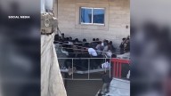 Balcony collapses in Gaza under weight of crowd scrambling for aid