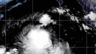 Tropical storms Juliette and Fernand churn over open waters in different oceans