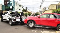 Grúas municipales siguen remolcando carros pese a prohibición del Tribunal Constitucional