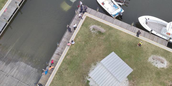 Truck follows flats boat off Venice boat ramp