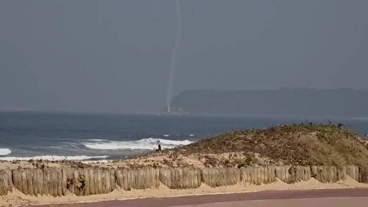 Horrifying moment plane corkscrews and nosedives into the sea at high speed during airshow as pilot feared dead