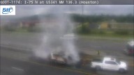 Van being pulled by tow truck catches on fire on I-75 in Perry, fire department says