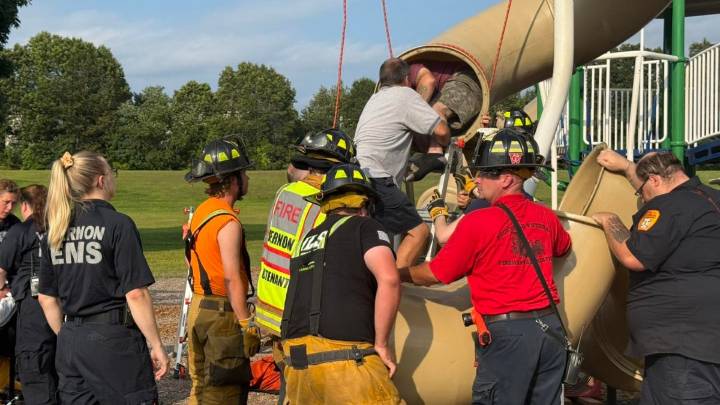 Firefighters rescue man stuck in slide on Conn. playground