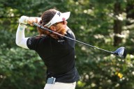 Miranda Wang waits a long time for a short birdie and leads rain