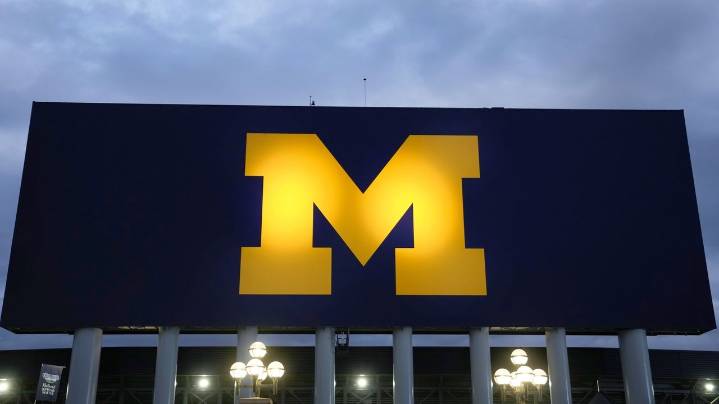 NCAA fines Michigan millions, adds game suspension for Moore over sign