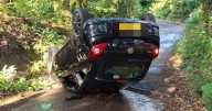 Car flips and lands on its roof after dramatic crash near beauty spot