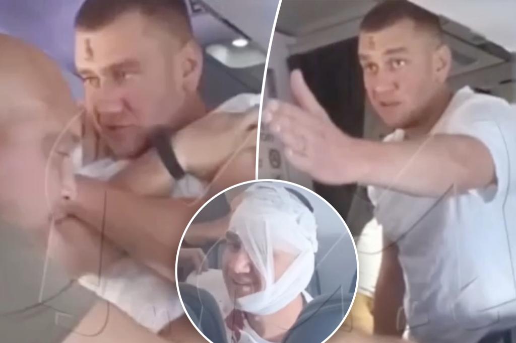 Belligerent passenger throws punches, drinks booze in bathroom