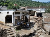 Photos: Hopes for survivors fade as Pakistan rescuers search for missing