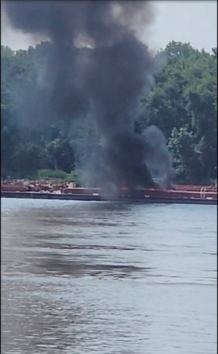 Two die when helicopter strikes powerlines and crashes into a barge on the Mississippi River