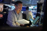 Wall Street drifts around its records following a worldwide rally