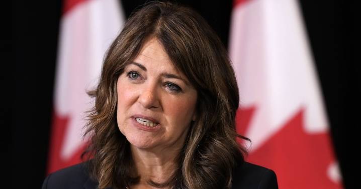 Smith defends charging Albertans for COVID