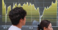 Asian shares mostly gain after uptick in inflation pulls US stocks lower