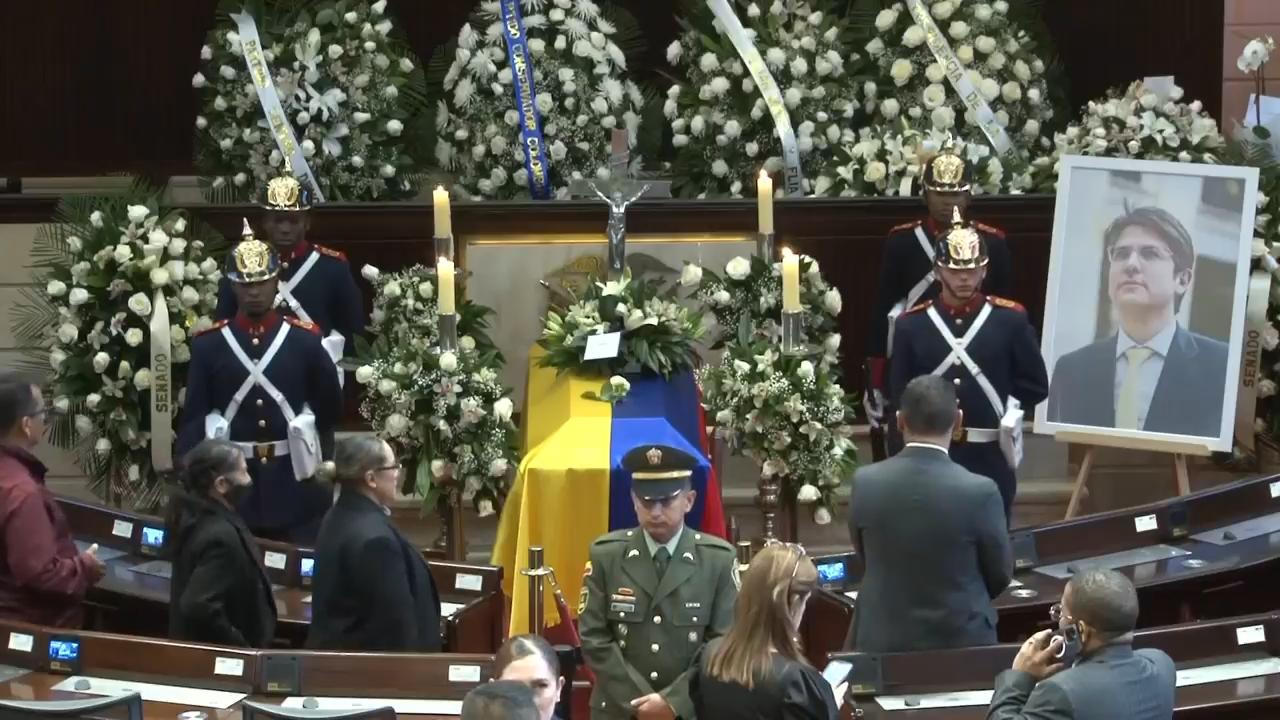 Mourners pay respects to late Colombian senator and presidential hopeful as his body lies in state in Congress