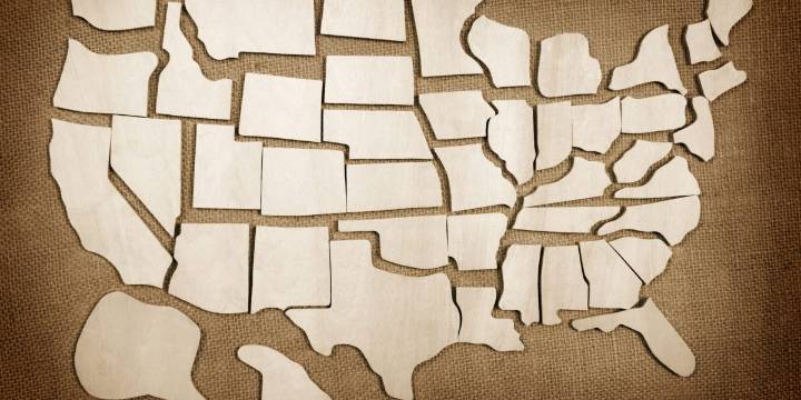 A third of the U.S. economy is already in a recession or at high risk, and another third is stagnating, Zandi warns