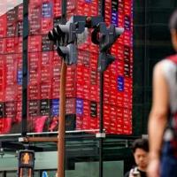 Asian markets dip after US tech slide
