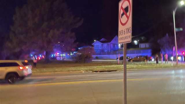Omaha police say shooting leaves one woman hurt, house and vehicles damaged
