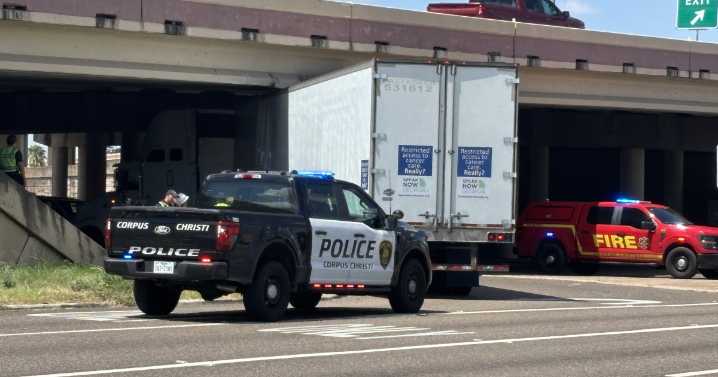 Driver cited after 18-wheeler lodges under SPID overpass