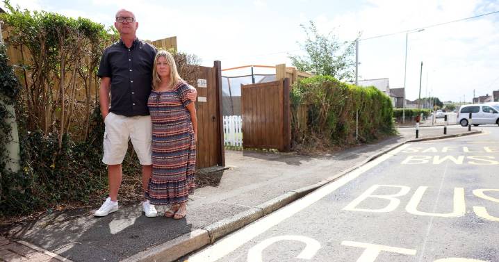 Couple slam 'ridiculous' bus stop put at bottom of their drive